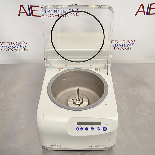 Slight high-angle front view of Eppendorf Vacufuge Plus 5305 centrifugal vacuum concentrator showing central spindle through clear top lid