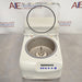 Slight high-angle front view of Eppendorf Vacufuge Plus 5305 centrifugal vacuum concentrator showing central spindle through clear top lid