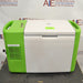 Stirling ULT25NEU portable ultralow freezer on a textured surface with a vibrant green and white housing, control panel, and Stirling Ultracold logo.