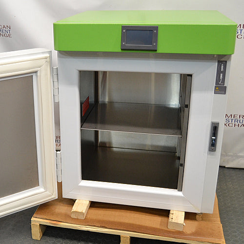 Three-quarter studio view of a Stirling Ultracold SU105UE undercounter ultralow freezer with the insulated door open, revealing the stainless steel interior chamber and a middle shelf.