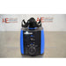 A straight-on front view of a blue and black Heathrow Scientific Vortexer featuring a top tube holder attachment, central power switch, speed control knob, and American Instrument Exchange background logo.
