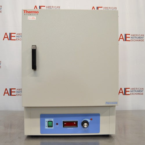 A straight-on front view of a Thermo Scientific PR305225M Precision mechanical convection oven resting on a stainless steel tabletop in front of an American Instrument Exchange backdrop