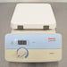 Straight-on studio view of a Thermo Scientific Cimarec+ laboratory hot plate featuring a white ceramic top plate, an angled front control panel with a digital heat LED display, a rotary control knob, and Thermo Scientific branding