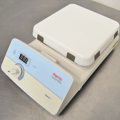 Three-quarter right-angled studio view of a Thermo Scientific Cimarec+ hot plate resting on a metallic work surface, displaying the white ceramic top heating plate and the control panel angled to the left