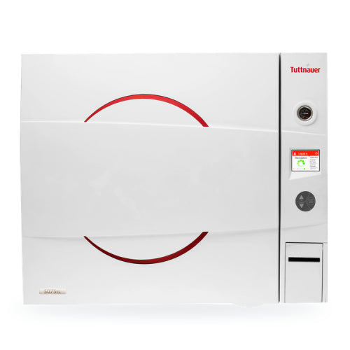A white Tuttnauer 5075EL-D benchtop autoclave with a red circular design on the front and a multi-color control panel.
