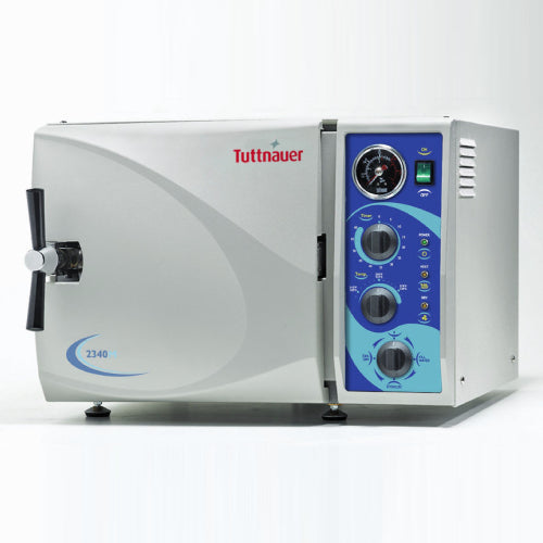 Tuttnauer 2340M Manual Tabletop Autoclave, silver in color, with control panel on the front. The device is designed for sterilization with a visible door for loading items.