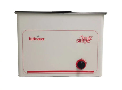 A Tuttnauer 6-Gallon Ultrasonic Cleaner with Heater, featuring a white body with red and black text, a heater switch, and the Tuttnauer logo.