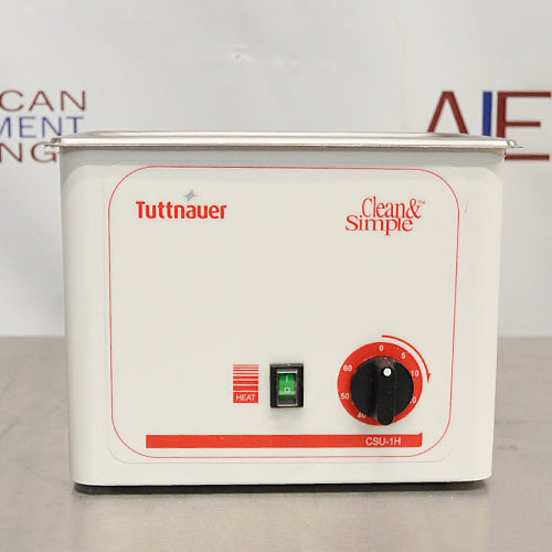 A Tuttnauer 1-Gallon Ultrasonic Cleaner with Heater, featuring a white and red exterior, a control knob on the front, and the brand name visible on the top.