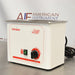 Angled view of a Tuttnauer Clean & Simple CSU1H ultrasonic cleaner showing the front panel with heat power switch, rotary timer knob, side casing, and attached power cord.