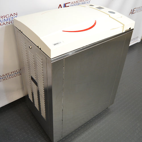 Tuttnauer vertical autoclave, stainless steel, with a white control panel on top, branded with Tuttnauer logo.