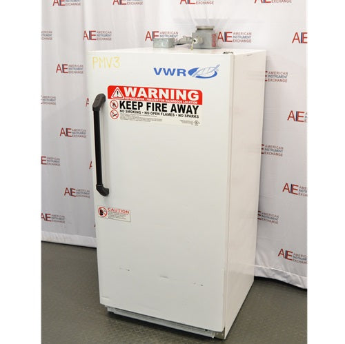 An alternative angled view of a VWR explosion-proof refrigerator available from American Instrument Exchange, showing its solid white exterior door, safety warning labels, and vertical handle.