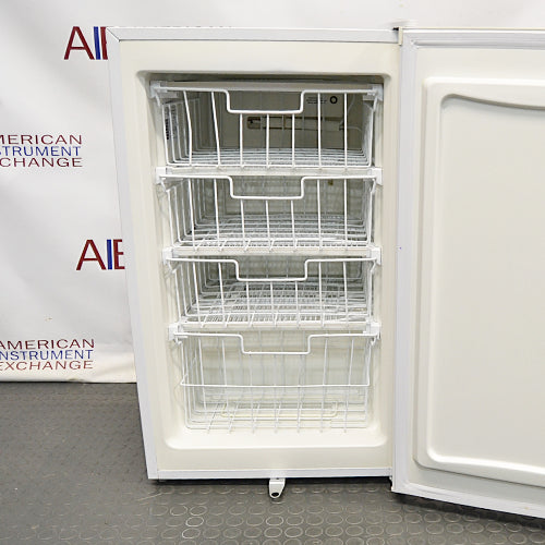 A white VWR freestanding undercounter freezer with a closed door, set against a backdrop featuring the 'American Instrument Exchange' logo.