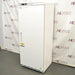 Right angled perspective view of an ABS -20C standard laboratory freezer, showcasing its white cabinet housing, solid locking door with a recessed vertical handle, American Biotech Supply branding, and a bottom ventilation grille