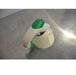 AccuPet AccuHelp motorized pipette controller, white with green accents, resting on a beige charging stand on a metal counter, seen in a side view