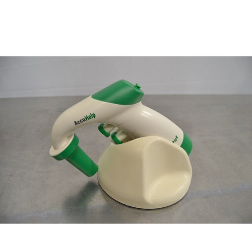 AccuPet AccuHelp motorized pipette controller in white and green resting on a matching desktop charging stand
