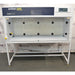 Front product view of an AirClean 6000 HLF horizontal laminar flow clean bench, featuring its white housing, dark blue upper control console, digital display, clear glass side and back panels, and supporting metal frame stand