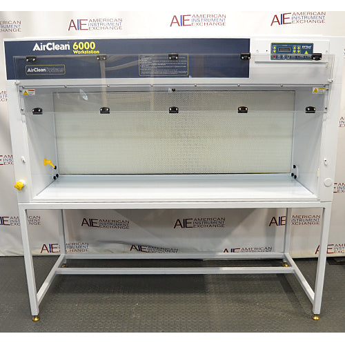 Straight-on eye-level product view of an AirClean 6000 HLF horizontal laminar flow clean bench, featuring its white structure, dark blue front upper panel, digital control interface, clear side panels, and metal support stand
