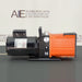 Profile side view of an Alcatel 2015 rotary vane vacuum pump on a dark surface, showcasing its black electric motor on the left, central carrying handle, and bright orange finned pump body on the right