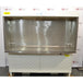 Front view of Baker Edgegard EG6320 horizontal laminar flow clean bench showing interior stainless steel work surface, back HEPA filter diffuser screen, and lower white support cabinet