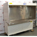 Left angled perspective view of Baker Edgegard EG6320 laminar flow clean bench showing outer enclosure side wall, interior stainless steel benchtop, rear airflow screen, and lower louvered support base