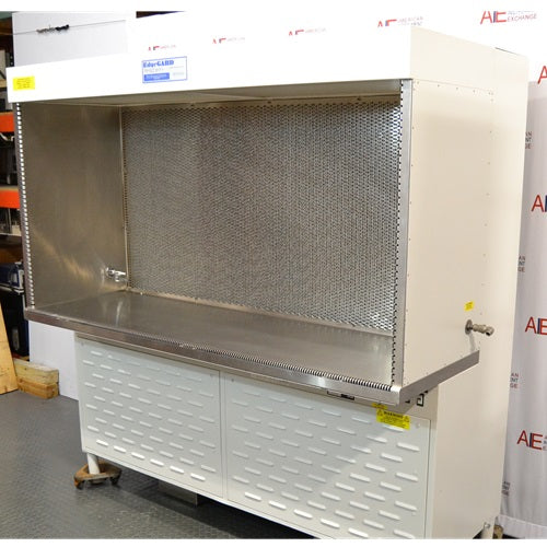 Right angled perspective view of Baker Edgegard EG6320 laminar flow clean bench showing open hood workspace, rear diffuser screen, stainless steel countertop, and side panel valve connections