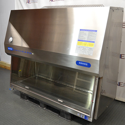 Right three-quarter angle product view of a Baker SterilGARD e3 SG604 stainless steel biosafety cabinet, featuring its right side panel, information placard, angled canopy, and stainless steel interior workspace