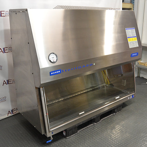 Three-quarter angle product view of a Baker SterilGARD e3 SG604 stainless steel biosafety cabinet, emphasizing its side panel profile, slanted front hood, pressure gauge, and stainless steel work surface