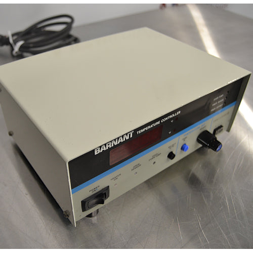 Left three-quarter angle product view of a Barnant 621-8600 temperature controller, showcasing the power switch, LED display panel, temperature adjustment knobs, and coiled power cord on a stainless steel surface