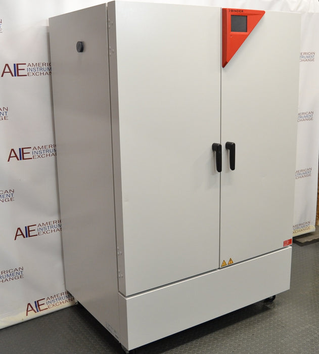 Angled perspective view of a Binder KMF 720 constant climate and humidity test chamber featuring closed solid doors, vertical handles, and its characteristic red control panel accent on the top right