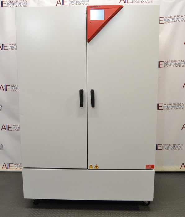 Front eye-level view of a Binder KMF 720 constant climate and humidity test chamber showing its closed solid double doors, vertical handles, and top-right red digital control interface