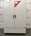 Front eye-level view of a Binder KMF 720 constant climate and humidity test chamber showing its closed solid double doors, vertical handles, and top-right red digital control interface