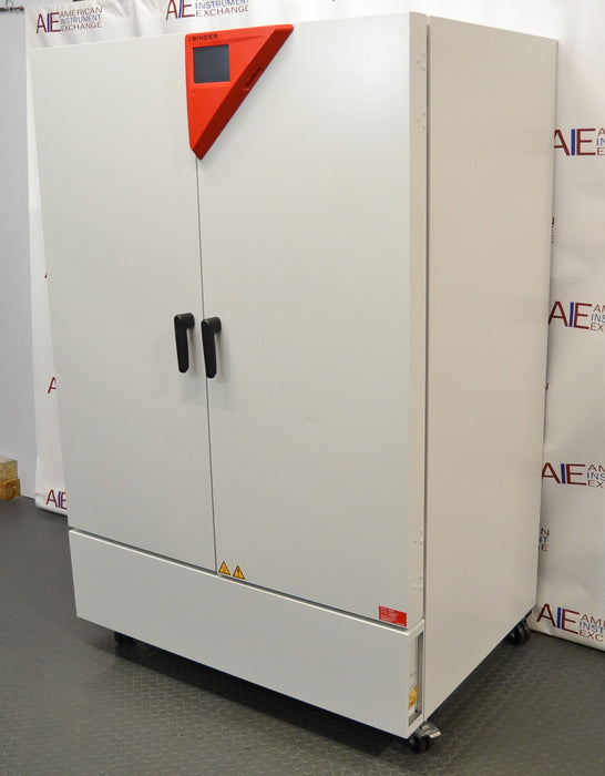 Left angled perspective view of a Binder KMF 720 constant climate and humidity test chamber showcasing its left side panel, closed double doors with handles, and caster-mounted base