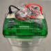 Top angle view of a Bio-Rad Mini-PROTEAN Tetra Cell electrophoresis system, featuring a green safety lid with warning text regarding core removal, along with coiled black and red power cables resting on top