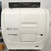 Straight-on front view of a BioTek Cytation 5 cell imaging multimode reader with a top-mounted CO2/O2 gas controller module, featuring its white main body, side access doors, and branded front panel