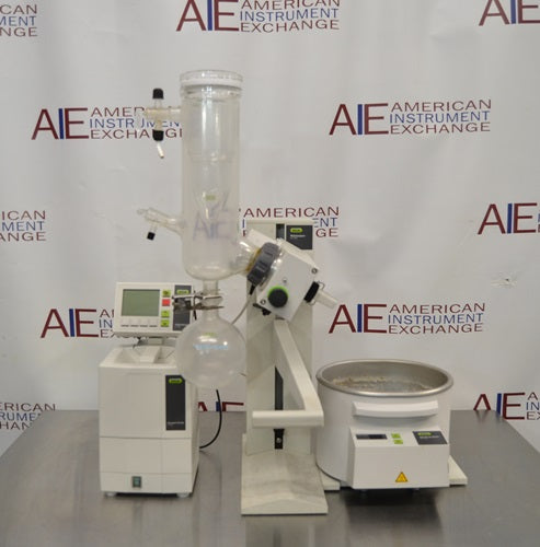 Front view of Buchi R-100 rotary evaporator system complete with heating bath, vertical glass condenser assembly, receiving flask, and digital controller interface