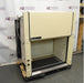 Left angled perspective view of a Classic Modular Systems chemical fume hood on a rolling platform featuring side utility panels and vertical sash