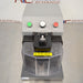 Elevated front product view of a Covaris cryoPREP CP02 dry pulverizer, showcasing its grey housing, clear protective front safety shield, central impact level dial, and control buttons