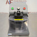 Front product view of a Covaris cryoPREP CP02 dry pulverizer, featuring its grey housing, clear protective front safety shield, central impact level dial, green activate button, and red power button