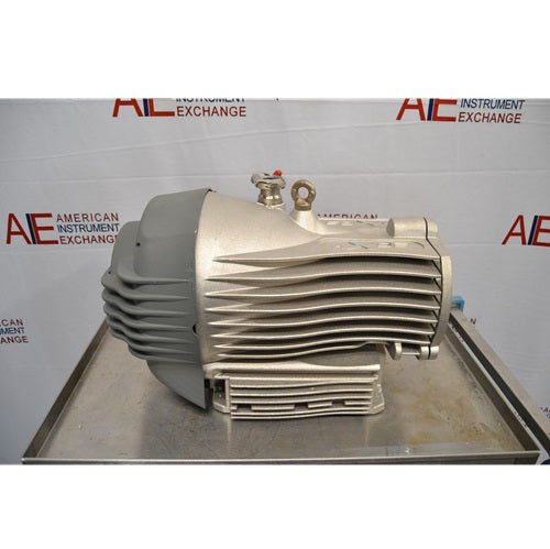 Full side profile view of an Edwards nXDS6i dry scroll vacuum pump resting on a metal cart, showing its finned casing, grey motor cover, and top lifting eyelet