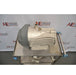 High three-quarter view from above showing an Edwards nXDS6i dry scroll vacuum pump on a stainless steel utility cart, highlighting its top inlet port, lifting eyelet, and finned body casing