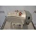 Side view of an Edwards nXDS6i dry scroll vacuum pump showing its finned metal housing, grey rear motor cover, top lifting eyelet, and red inlet valve cap