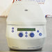 Front eye-level view of a new-in-box Eppendorf 5425R refrigerated microcentrifuge, showcasing its light grey housing, closed lid, and front digital control panel with dual blue rotary knobs and LCD screen