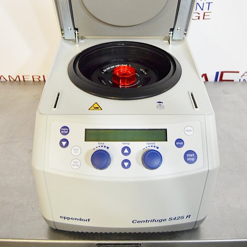Front eye-level view of an Eppendorf 5425R refrigerated microcentrifuge with its top lid open, showing the internal rotor with a red locking lid and the front digital control panel
