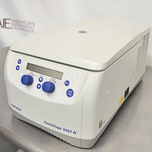 Right three-quarter angle product view of an Eppendorf 5427R refrigerated microcentrifuge, highlighting the right side panel ventilation louvers, housing profile, and digital control pad on a metal workbench