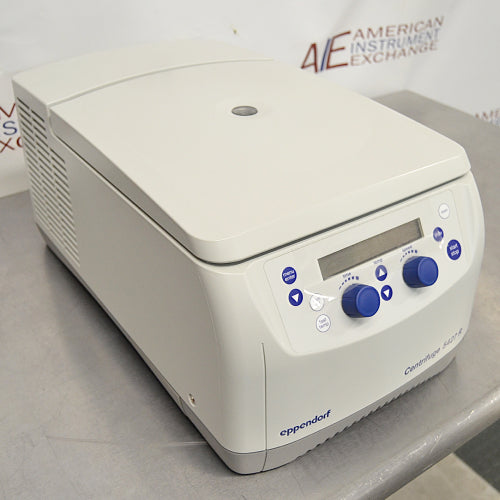Three-quarter angle product view of an Eppendorf 5427R refrigerated microcentrifuge, highlighting the cooling vent side louvers, curved housing lid, and digital front control interface on a stainless steel surface
