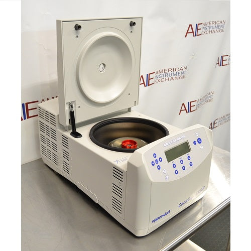 Right angled perspective view of Eppendorf 5430 R refrigerated benchtop centrifuge with open lid on stainless steel table showing installed rotor and keypad control panel