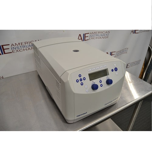 Right angled perspective view of Eppendorf 5430 R refrigerated microcentrifuge with closed lid on stainless steel table showing front digital control panel