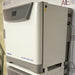 Right three-quarter angle product view of an Eppendorf New Brunswick S41i CO2 incubator with integrated shaker, showcasing the side housing panel, connected cables, and digital display console