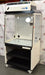 Front angled perspective view of an Erlab Captair XL1044 ductless fume hood on a locking caster stand, highlighting its clear viewing enclosure, top-mounted control panel and filter module, and internal work surface