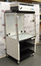 Right angled perspective view of an Erlab Captair XL1044 ductless fume hood on a mobile locking stand, showing its clear side and front panels, upper filtration control unit, and lower storage shelves